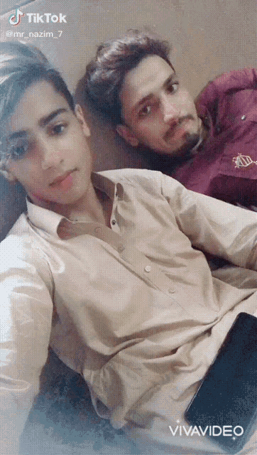 two young men are posing for a picture and the caption says tik tok