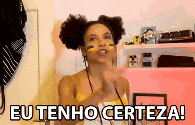 a woman with a brazilian flag on her face says eu tenho certeza