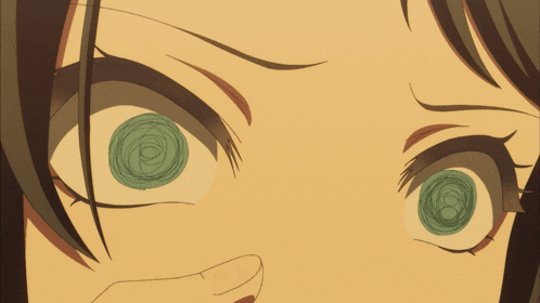 a close up of a woman 's eyes with a green circle in them