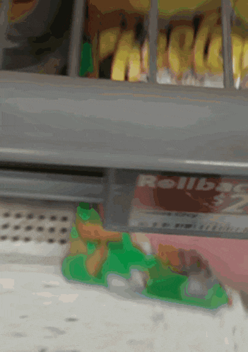 a close up of a shelf with a box of rollbacks