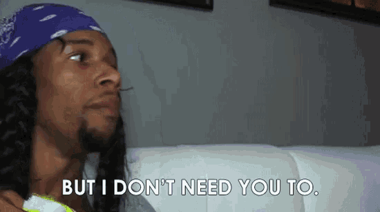 a man wearing a bandana is sitting on a couch and says `` but i don 't need you to ''