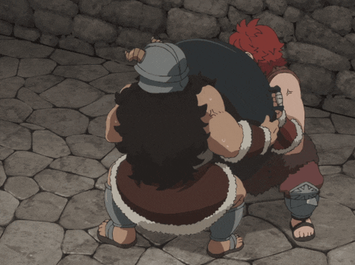 a man with a tattoo on his arm holds another man in a wrestling match