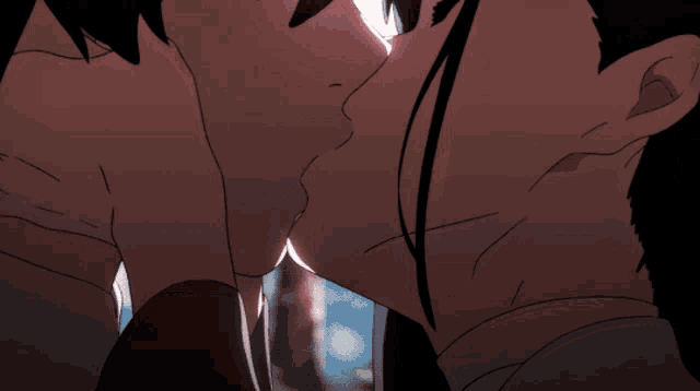 a man and a woman are kissing each other