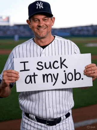 a man in a ny yankees uniform holds up a sign that says i suck at my job