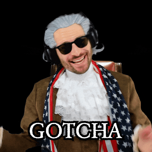 a man with a scarf around his neck is wearing gotcha