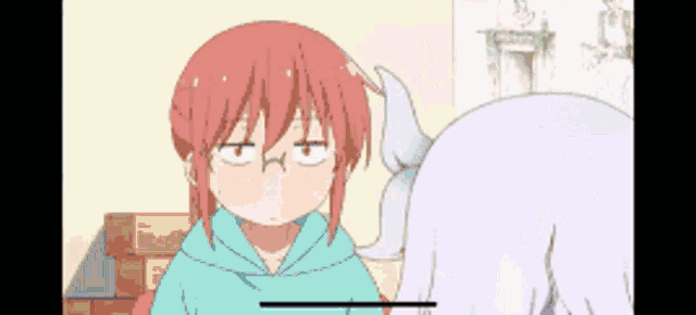 a girl with red hair is making a funny face while standing next to a white girl with horns .