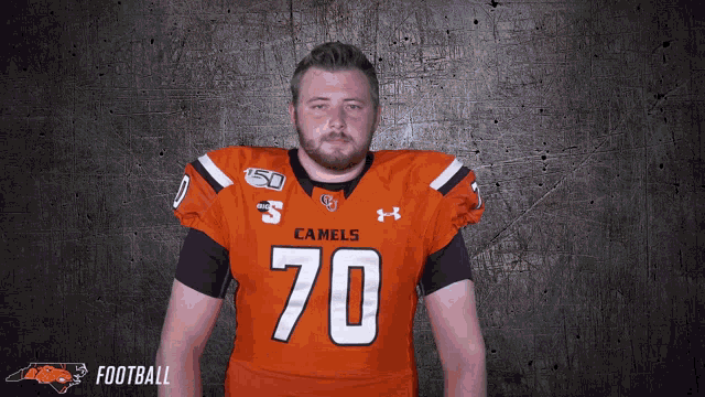 a man in an orange jersey with the number 70