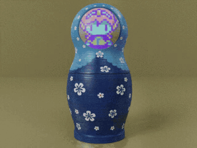 three russian nesting dolls with flowers on them