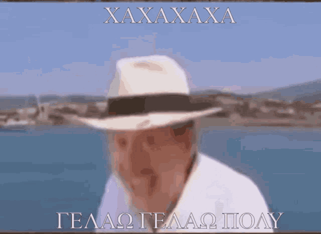 a man wearing a white hat with the words xaxaxaxa written on it