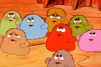 a group of colorful cartoon characters standing on a wooden floor
