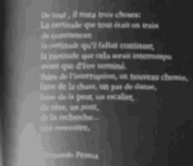 a book is open to a page with a poem in french on it