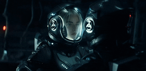 a man is wearing a helmet and looking up at the sky .