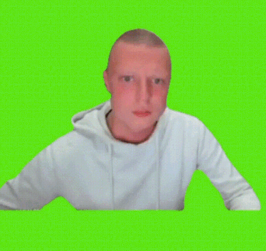 a man in a white sweatshirt is giving a thumbs up on a green screen