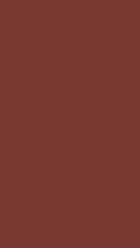 a man wearing glasses is laying on a red background with the word ran
