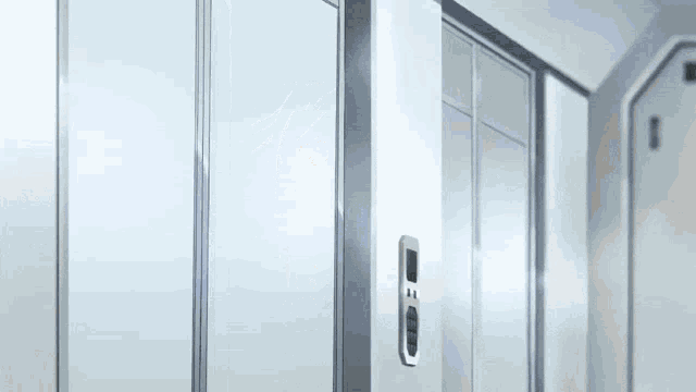 a row of lockers in a locker room with a door that is open .