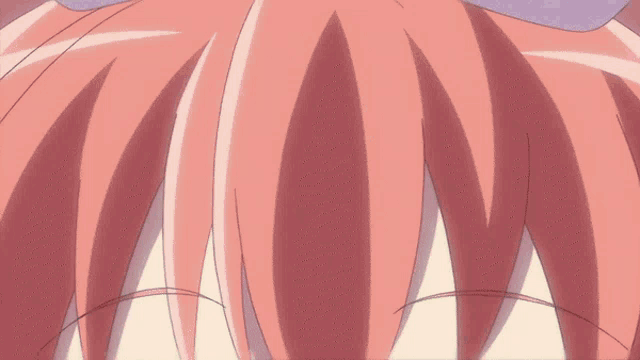 a close up of a girl 's face with red eyes