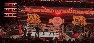 a wrestling ring with the words " and new world tag team champions "