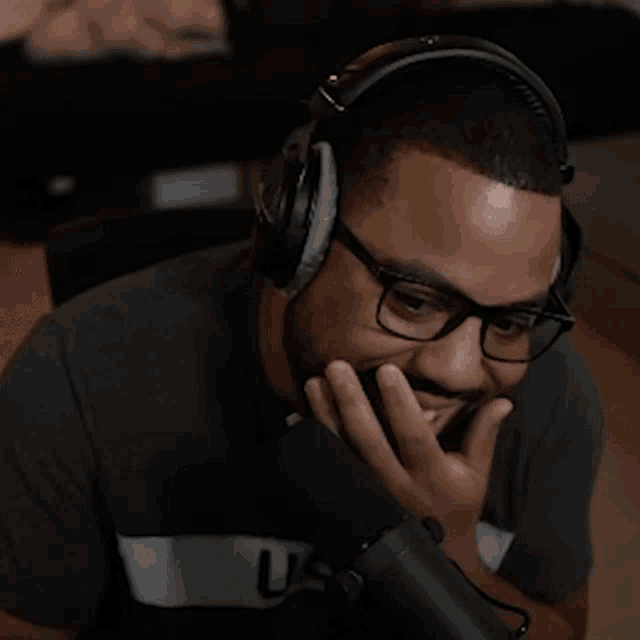 a man wearing headphones and a shirt that has the word us on it
