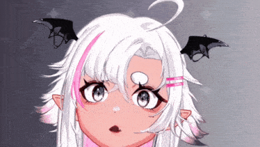 a close up of a girl 's face with bat wings on her ears