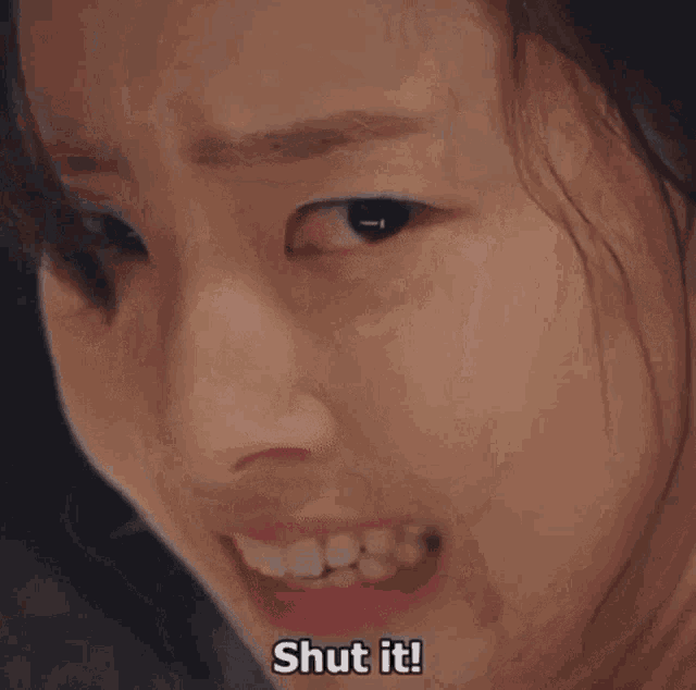 a close up of a woman 's face with the words `` no '' written on it .