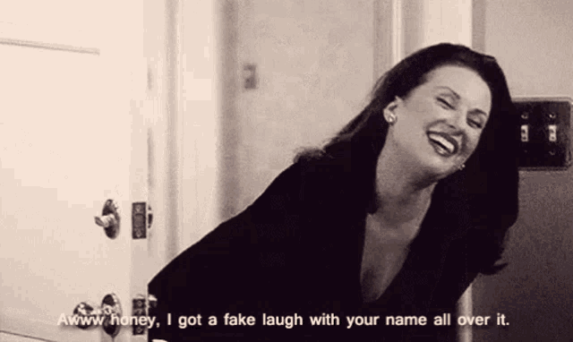a woman is laughing and saying " honey , i got a fake laugh with your name all over it "