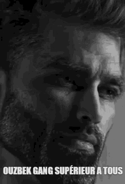 a black and white photo of a man with a beard and the words ouzbek gang superior a tous written on it .
