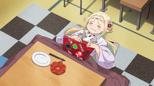 a girl is laying on a checkered floor with a laptop and a plate