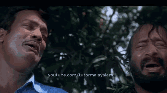 two men are crying in front of a tree with youtube.com/tutormalayalam in the corner