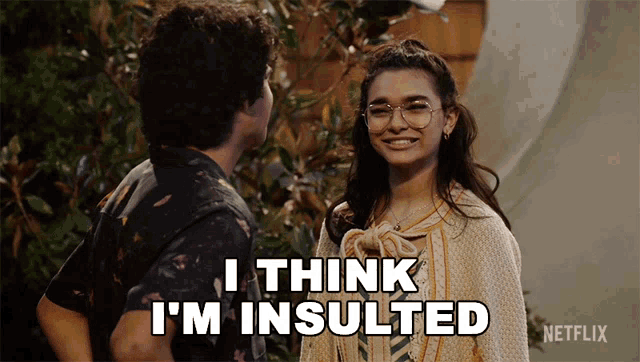 a man and a woman are standing next to each other and the woman says i think i 'm insulted