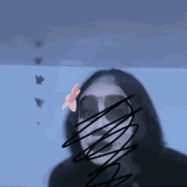 a person with a skeleton mask on their face .