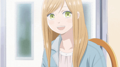 a girl with long blonde hair and green eyes