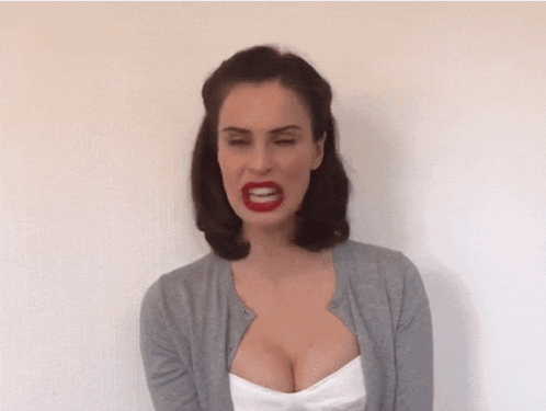 a woman with red lipstick on her lips is screaming