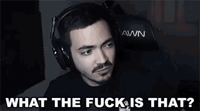 a man wearing headphones is asking what the fuck is that