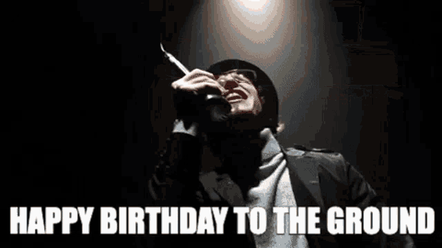a person standing on a sidewalk with the words " happy birthday to the ground "