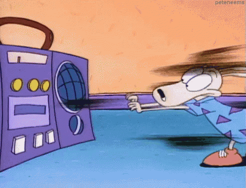 a cartoon character is standing in front of a boombox .
