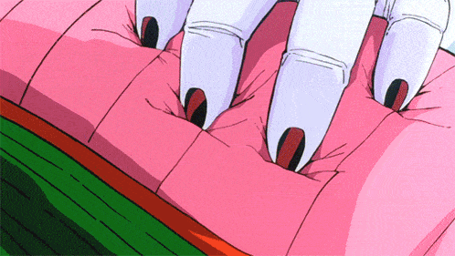 a close up of a person 's hands on a pink cushion