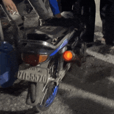 a motorcycle with a license plate that says 710-45670