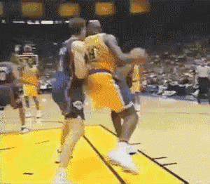 a basketball player wearing a number 13 jersey is being blocked by another player