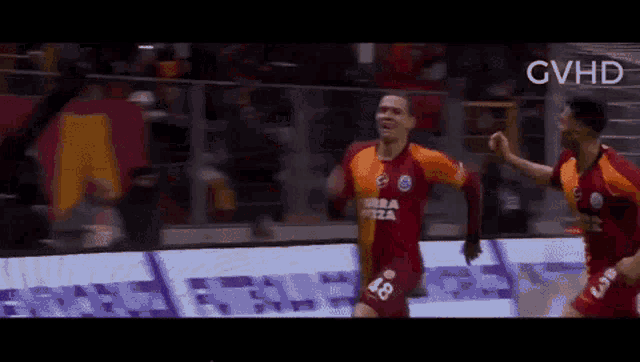 a soccer player wearing a jersey that says 48 on it