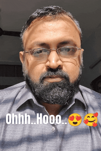 a man with glasses and a beard has the words ohhh hooo written on his face