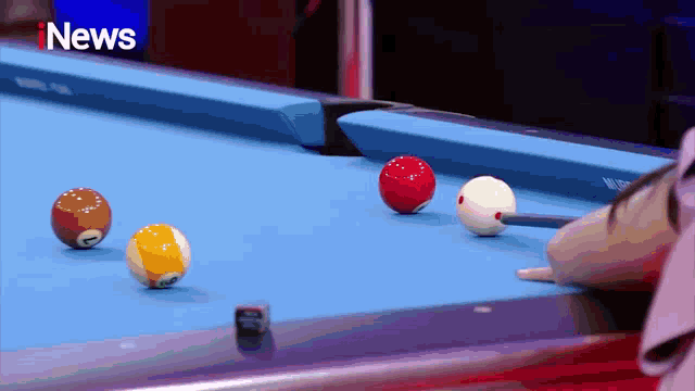 a pool table with the word inews on the bottom