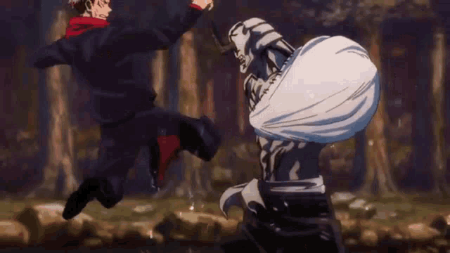 a man is kicking a monster in the face while another man watches .