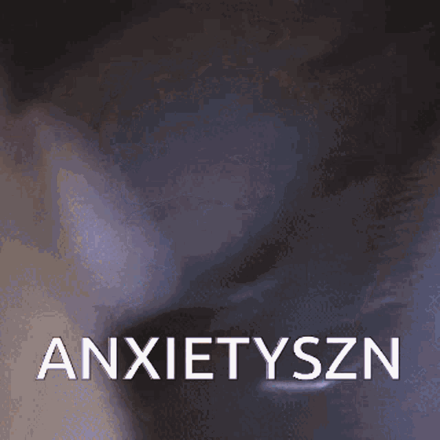 a close up of a person 's hand with the word anxietyszn in white