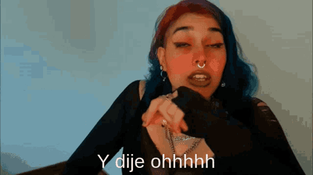 a woman with red and blue hair says y dije ohhhh