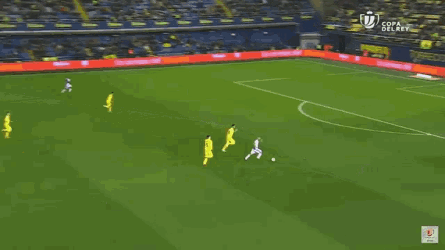a soccer game is being played on a field with advertisements for torrecid porcelanosa and esmalglass itaca
