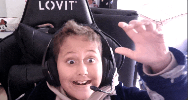 a boy wearing headphones with a microphone and a lovit chair behind him