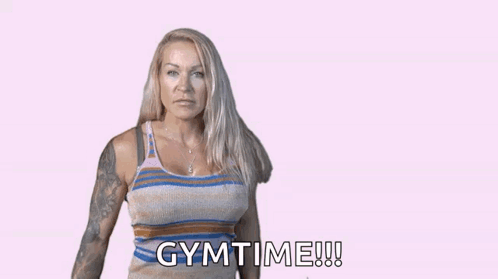 a woman flexes her muscles in front of a pink background that says girl power gymtime
