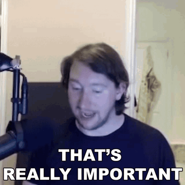 a man in front of a microphone with the words that 's really important