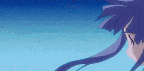 a close up of a person 's head with purple hair against a blue background .