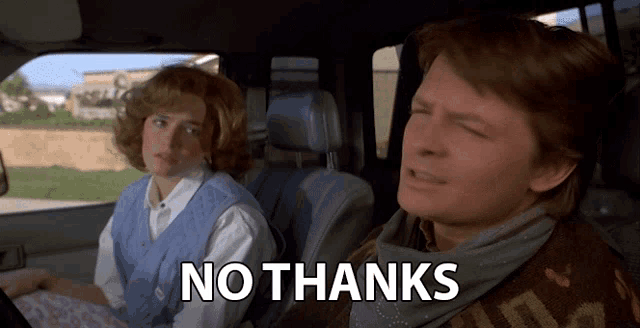 a man and a woman are sitting in a car with the words no thanks on the screen